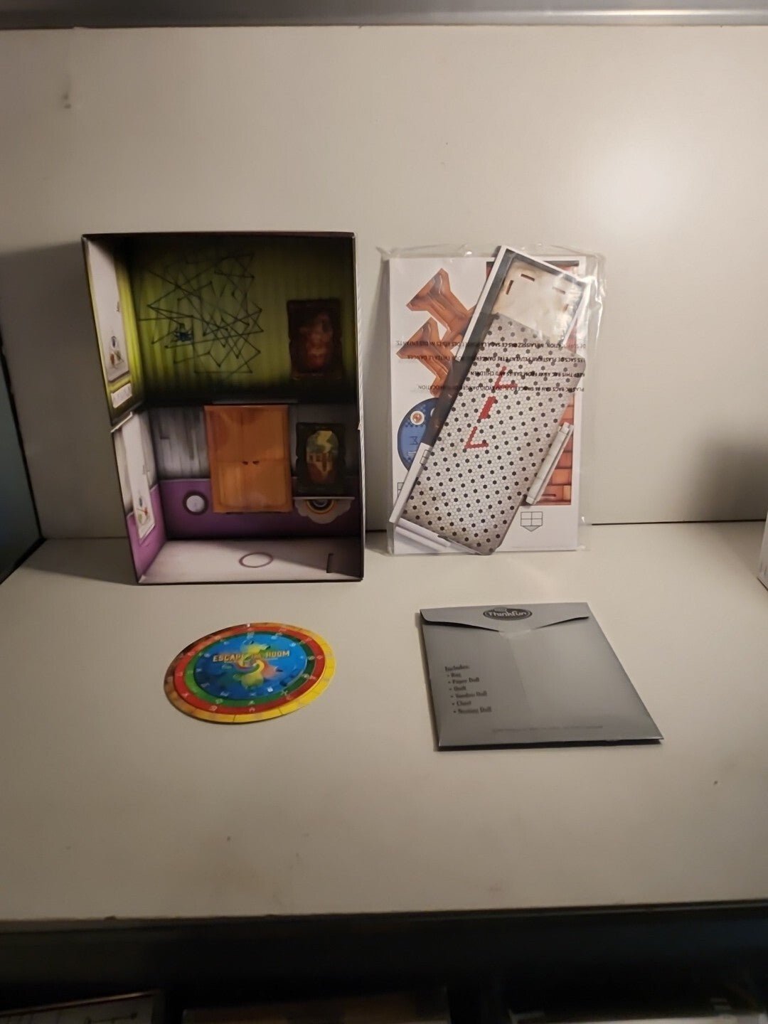 Escape The Room Board Game - The Cursed Dollhouse by ThinkFun - Darktower Media