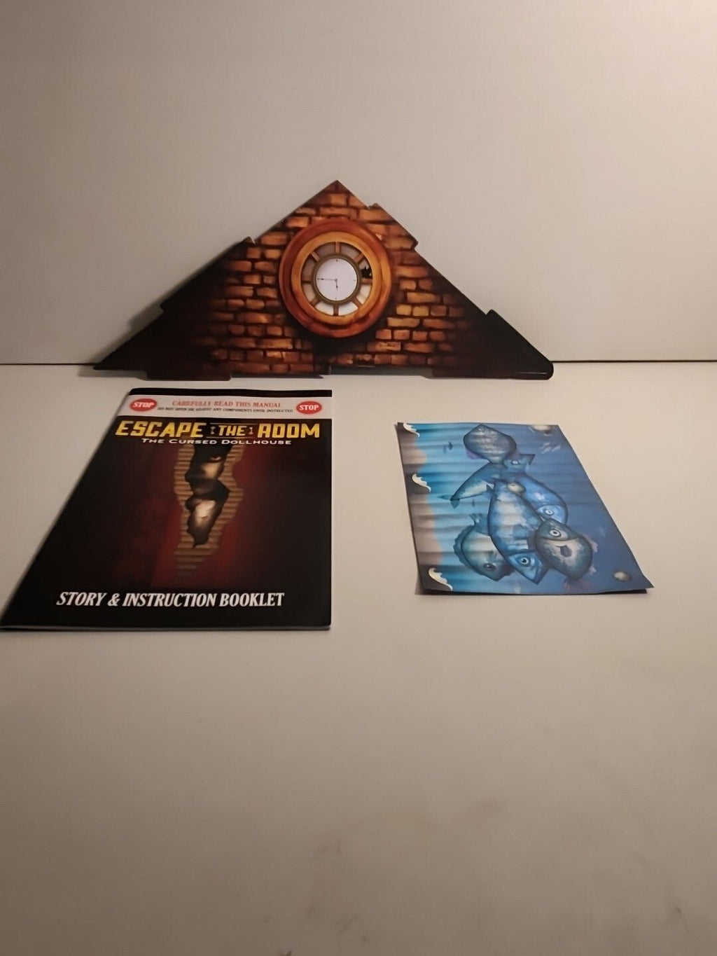 Escape The Room Board Game - The Cursed Dollhouse by ThinkFun - Darktower Media