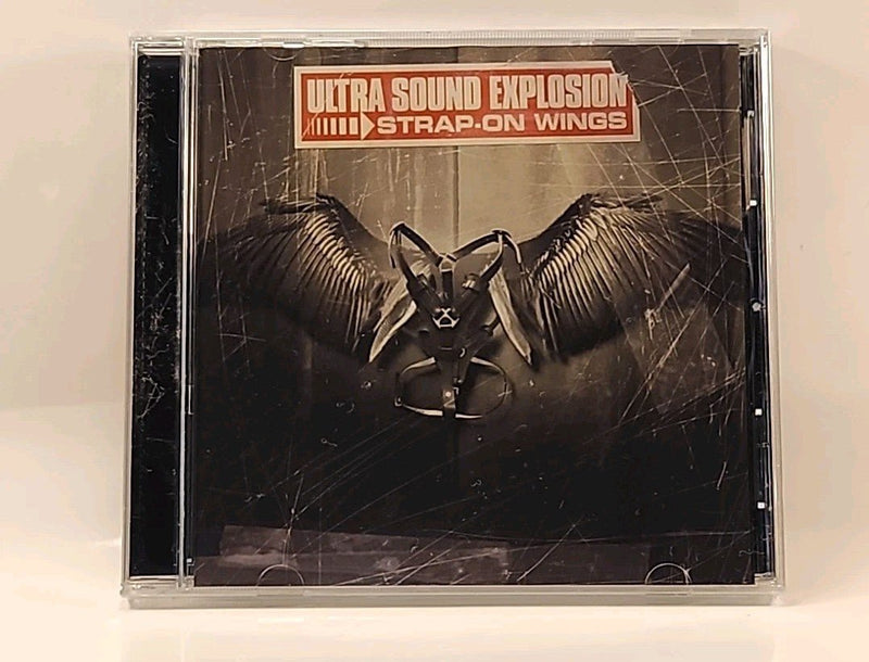 Ultra Sound Explosion - Strap - On Wings - CD USA ELLIOT EASTON w1s1 1209 - 10 - Darktower Media